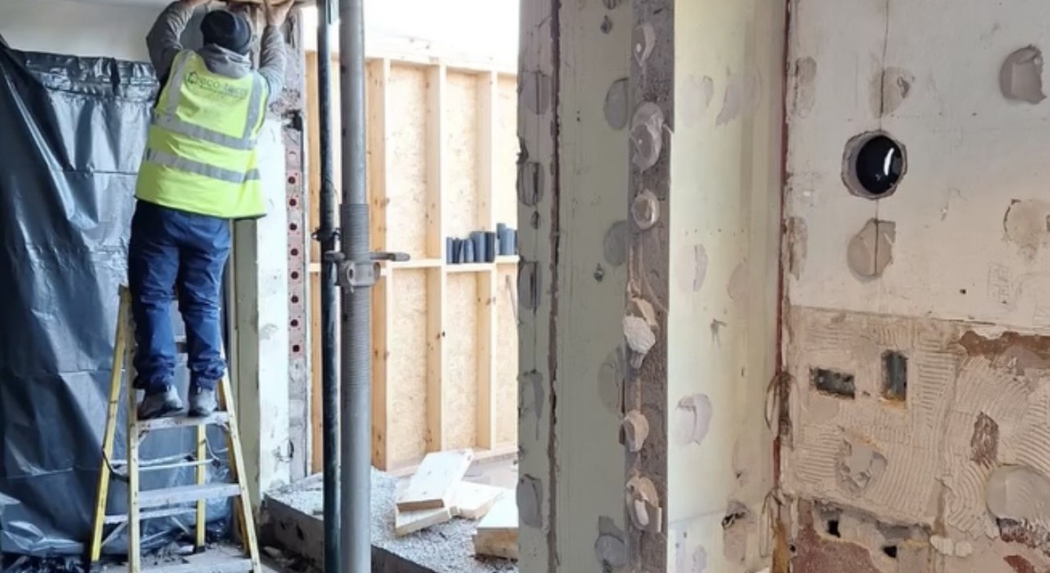 Blitz operative forming a large structural opening through a reinforced concrete wall in Cork