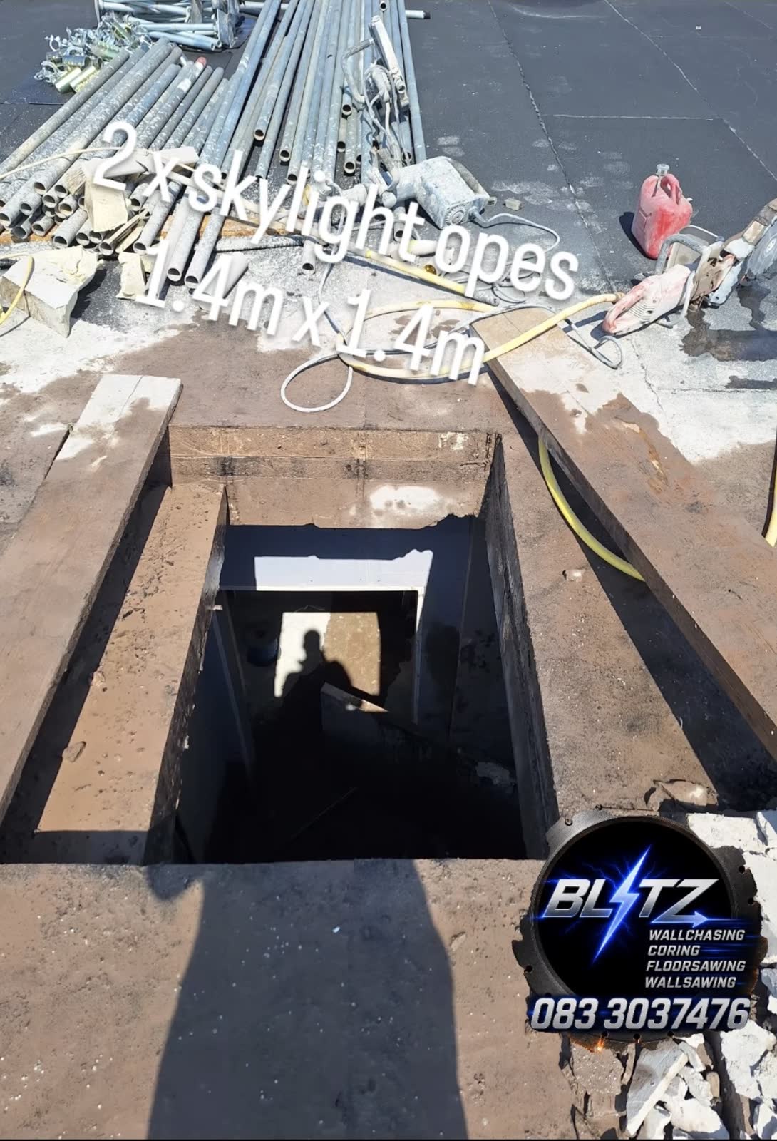 Two skylight openings cut through a flat reinforced concrete roof — Cork