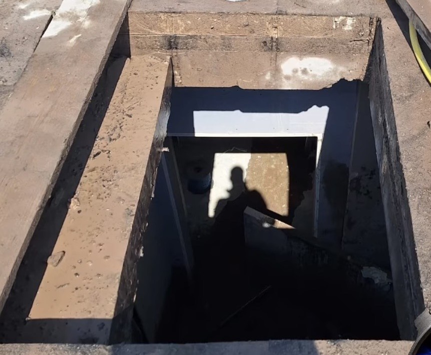 Completed 1.4m x 1.4m skylight opening cut through a flat concrete roof