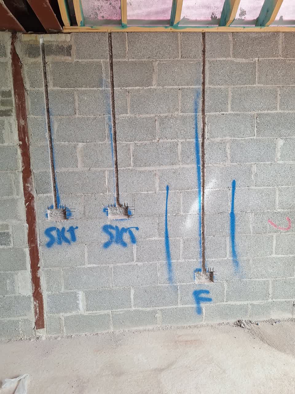 Clean wall chasing channels for electrical conduit — socket and spur positions marked, Munster